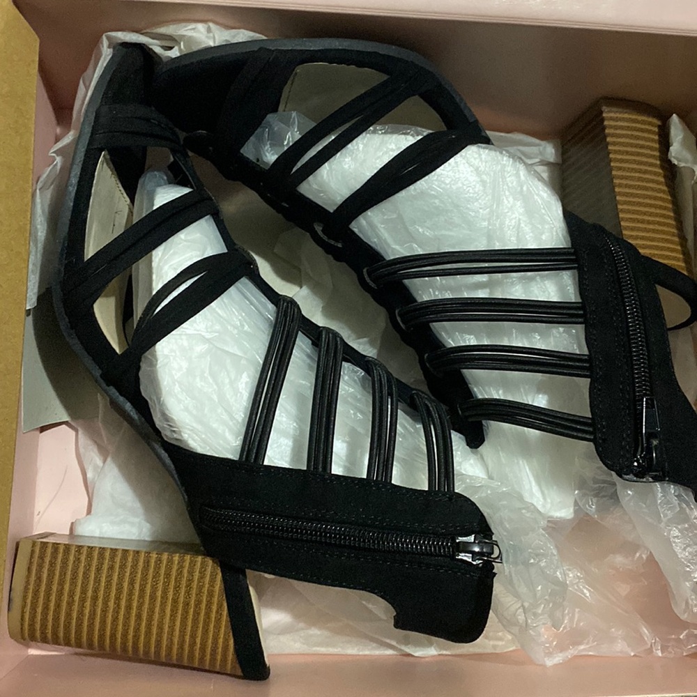 Black suede heels from Charlotte Russe. Light brown heel and open toed.
